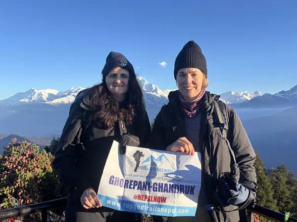 happy trekker at poon hill with rugged trails nepal