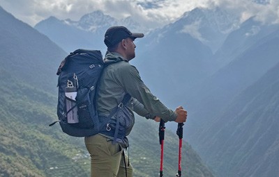 nirajan standing on top of sherpagaun