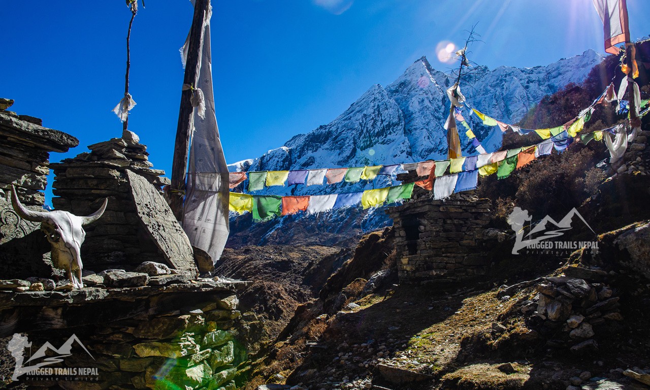 prayers flags and buddhist mantras on the manaslu trail