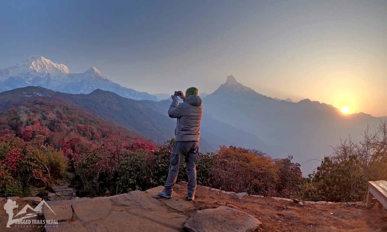 spring season view from Badal Danda (Twin Peak) with sunrise, mt fishtail, annapurna mountain, and the colorful flowers