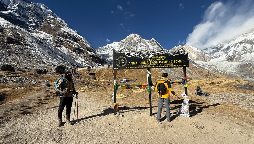 the new sign at the annapurna base camp and the helicopter landing area