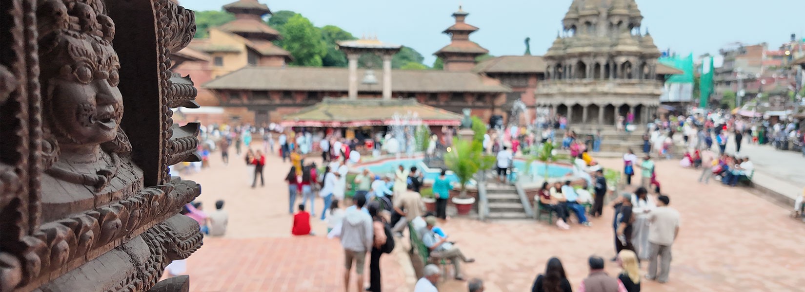 Crowds of visitors and locals at Patan Durbar Square ancient temple plaza in Nepal