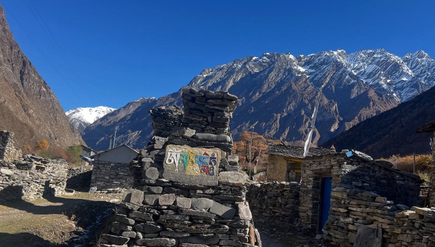 mountain views and mantras on stone wall